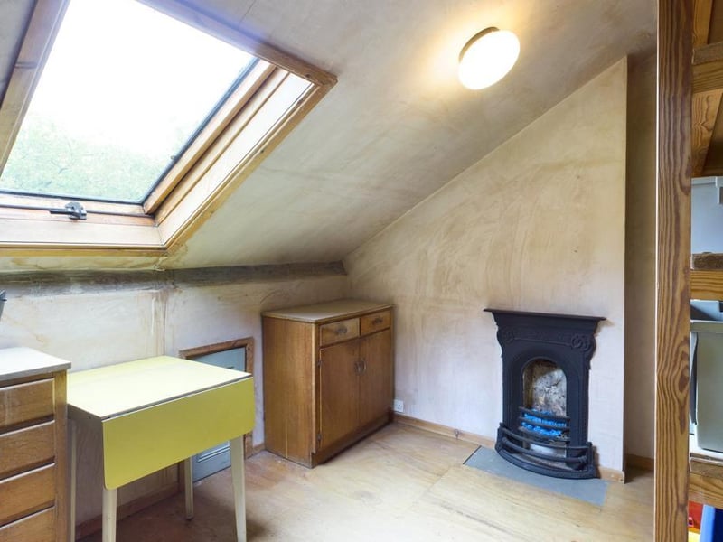 Second floor bedroom - Sealed unit double glazed timber framed roof window, exposed ceiling beams, cast iron period bedroom fireplace, access to roof space.