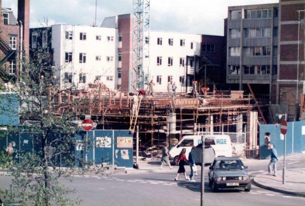 Construction of the new Odeon Cinema, Barkers Pool at the junction with (right) Burgess Street, 1986