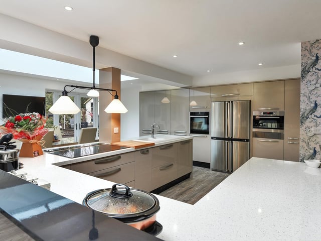 The modern kitchen has plenty of space.
