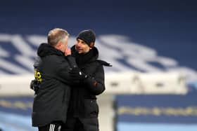 Josep Guardiola manager of Manchester City talks to Chris Wilder manager of Sheffield Utd after the Premier League match at the Etihad Stadium, Manchester. Darren Staples/Sportimage