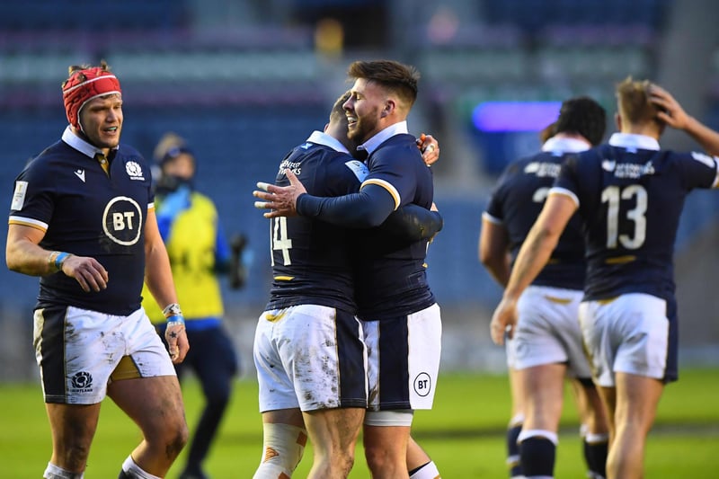 Scotland's wing Darcy Graham (CL) celebrates with team-mates after scoring a try during the Six Nations international rugby union match between Scotland and Wales