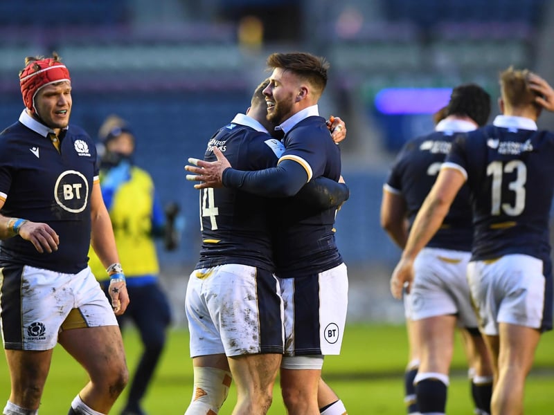 Scotland's wing Darcy Graham (CL) celebrates with team-mates after scoring a try during the Six Nations international rugby union match between Scotland and Wales