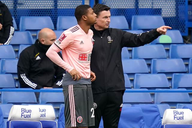 Sheffield United's Rhian Brewster (left) speaks with interim manager Paul Heckingbottom prior to going onto the pitch during the Emirates FA Cup quarter final match at Stamford Bridge, London: John Walton/PA Wire.