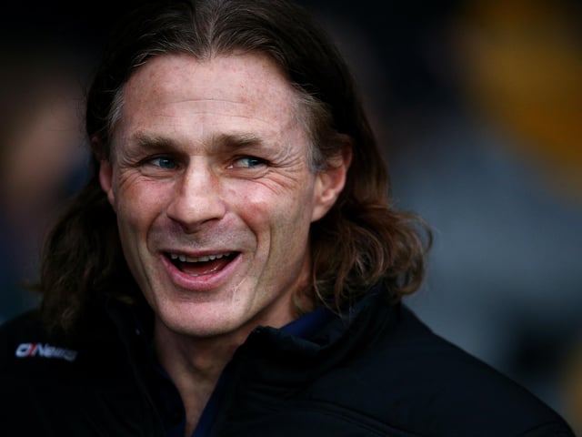 Average career win record: 40.6%. Best record: 40.6% (Wycombe Wanderers). Worst record: N/A.