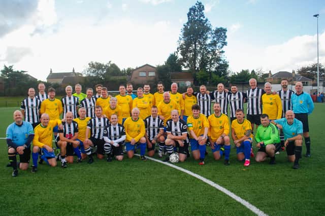 The teams - Santa's Superstars and Cammy's Legends - before the match.