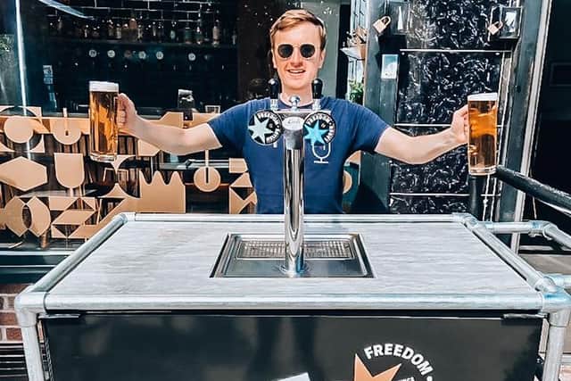 Two Thirds co-owner Adam Inns pictured with two pints of Freedom Lager that customers can redeem on so-called "freedom day" on Monday, July 19