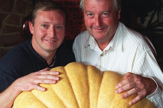 Landlord of the Crossfield Tavern Chris Smith (right) with pumpkin grower Keith Hudson in 1998