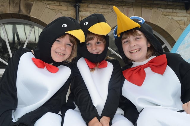 Whaley Bridge Carnival, Fern, Amy and Dawn Arnold pick up a penguin 