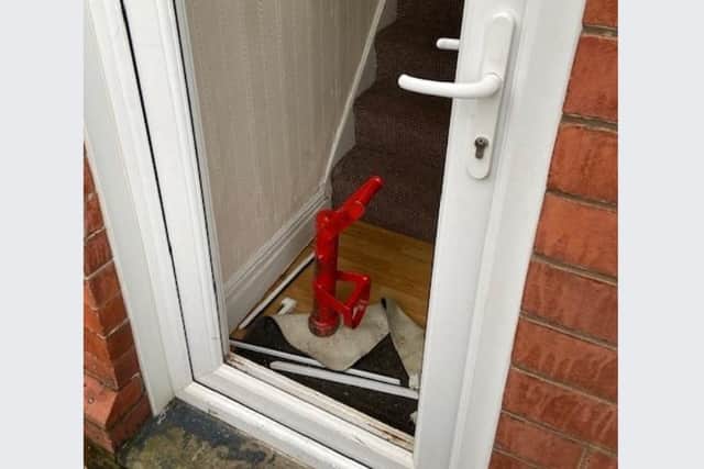 Police have raided a major cannabis factory on a Sheffield estate this morning. Picture shows the door after the house was entered by officers