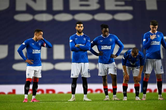 Rangers players look on as St Johnstone win the penalty shoot-out. (Photo by Rob Casey / SNS Group)