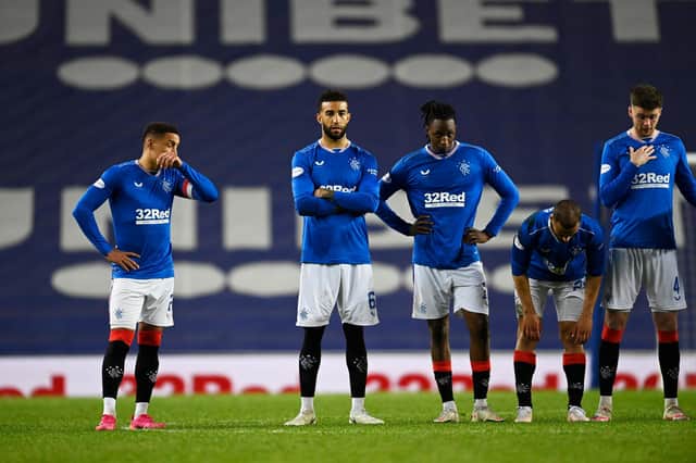 Rangers players look on as St Johnstone win the penalty shoot-out. (Photo by Rob Casey / SNS Group)