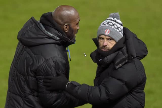 Darren Moore shakes the hand of Paul Warne after a South Yorkshire derby last season.
