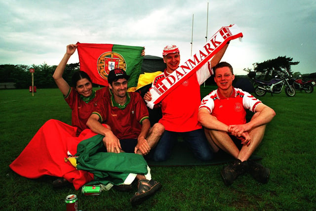 Silvia Farto and Jose Santos of Portugal with Thomas Diechmann and Henrik Laurtzen from Denmark camping on the Sheffield Tigers Rugby Union pitch at Dore, Sheffield for Euro 96. Photo: Chris Lawton, National World