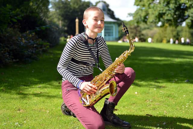 Mia Virgo-Cox has just had her had shaved and is donating her hair to the Little Princess Trust. A keen musician Mia is pictured performing a saxophone gig in Weston Park.