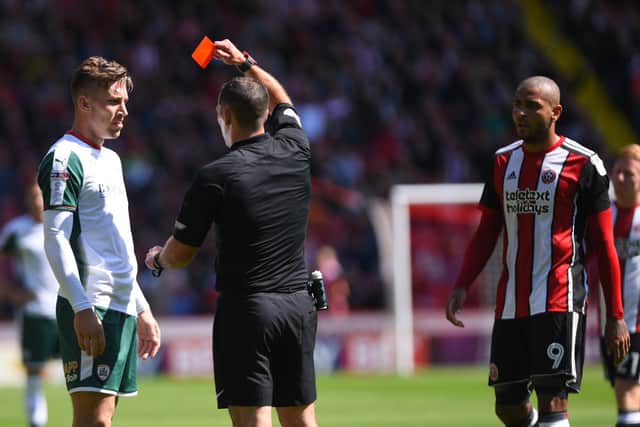 Angus MacDonald of Barnsley and Leon Clarke of Sheffield United are sent of during a meeting between both sides in 2017. Photo: Nathan Stirk/Getty Images.