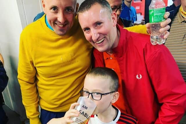 Stephen Clifton, better known as Mouse, tragically took his own life aged just 38. Here he is pictured (back right) with his friend Simon Jenkins (back left) and a young Blades supporter called George during a Sheffield United game on the day he died