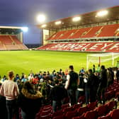 Barnsley fans protest against the owners after the final whistle during the Sky Bet Championship match at Oakwell Stadium, Barnsley. Picture date: Saturday January 29, 2022. PA Photo.