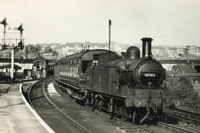 Driver Frank Boulton brings a train into Buxton's Midland station in the week of his retirement in the 1950s