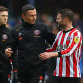 Sheffield United manager Paul Heckingbottom speaks with Oli Norwood, whose contract is about to expire: Matthew Lewis/Getty Images