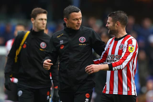 Sheffield United manager Paul Heckingbottom speaks with Oli Norwood, whose contract is about to expire: Matthew Lewis/Getty Images
