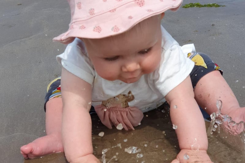Felicity, aged 10 months, enjoys a splash.