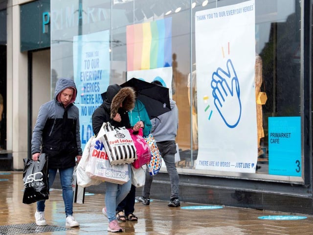 Hundreds of people were seen clutching bags of shopping in the capital as shops reopened