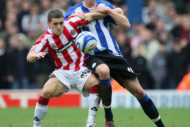 Billy Sharp uses his body to hold off the challenge of Mark Beevers during his second spell with the Blades.  (Photo by Laurence Griffiths/Getty Images)