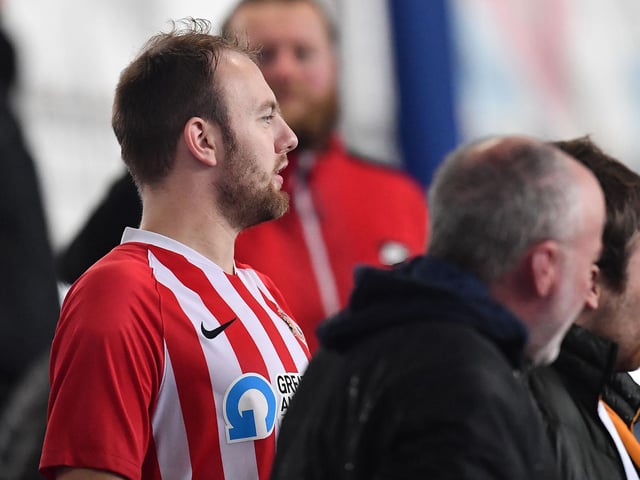 A Sunderland fan wearing his red and white colours at Fratton Park.