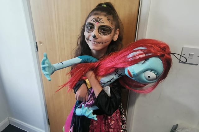 12-year-old Layla, and Sally from the Nightmare Before Christmas, show off their outfits.