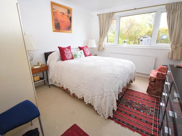The main bedroom is described by the estate agents as "having a tranquil, relaxed atmosphere". Its window looks out to the back of the bungalow and there is access to an en suite bathroom.