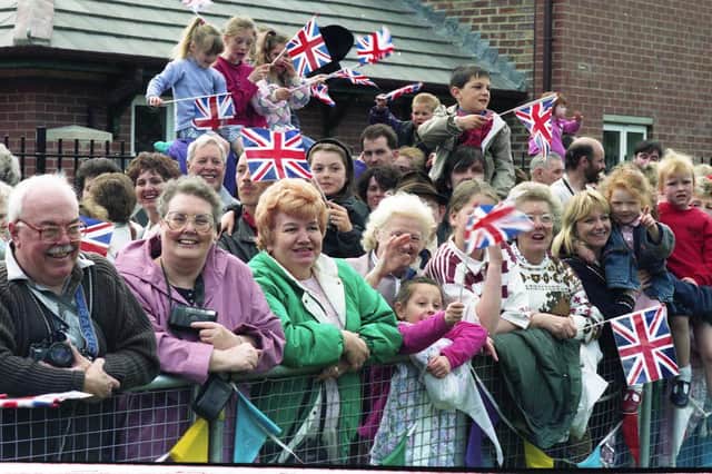 Her Majesty the Queen was coming to town and these spectators made sure they had a front row view for the occasion in 1993.