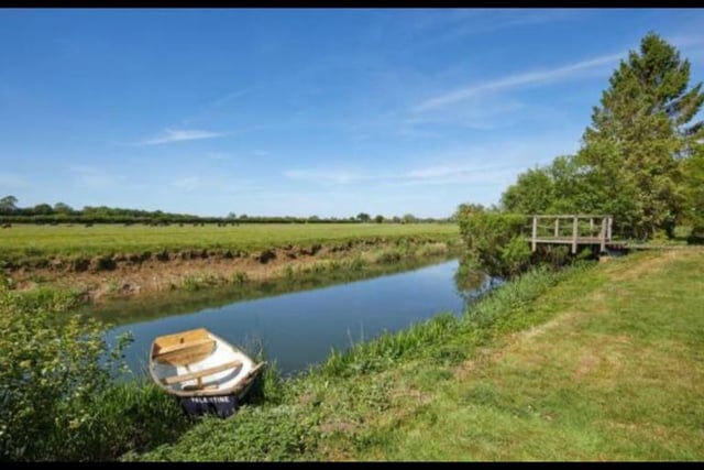The sweeping driveway leads you through stone pillars and part of the impressive landscaped gardens towards the house, where a picturesque pond with stream running into the River Great Ouse sits adjacent to it. The proximity to the river is a bonus as the house comes with fishing rights on the river.