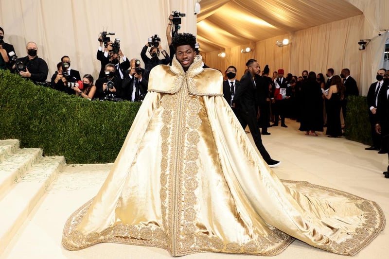 Rapper Lil Nas X rocked the Met Gala with not just one but three looks. First a massive golden royal gown.