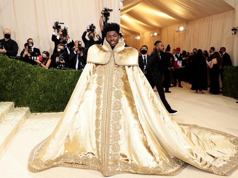 Rapper Lil Nas X rocked the Met Gala with not just one but three looks. First a massive golden royal gown.