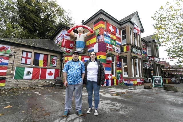 Landlords Helena, 42, and Mark Bennett, 48, have decorated their pub, The Big Tree pub in Sheffield, with flags from around the world.