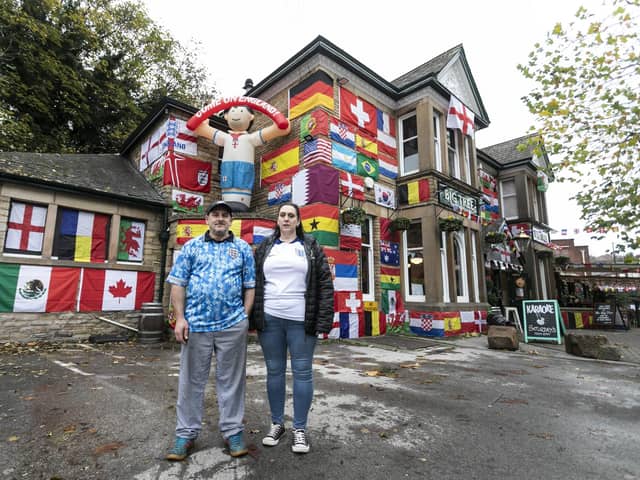 Landlords Helena, 42, and Mark Bennett, 48, have decorated their pub, The Big Tree pub in Sheffield, with flags from around the world.