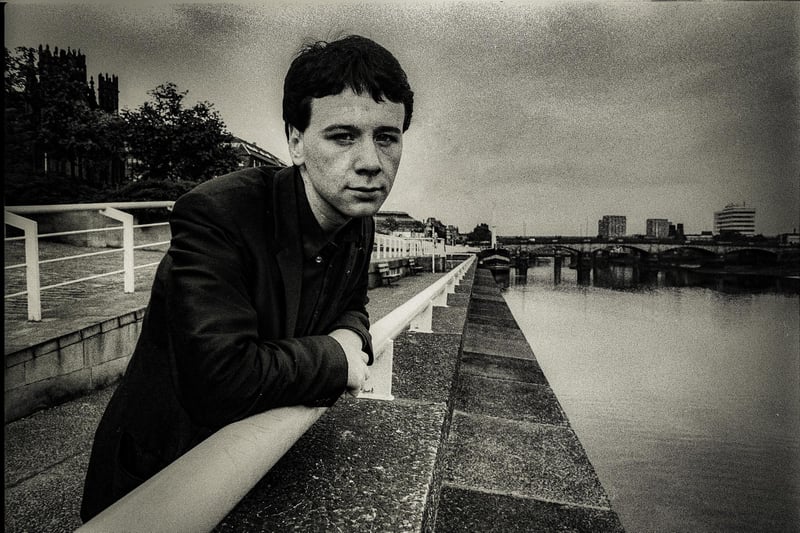 A young Jim Kerr standing on the banks of the River Clyde which was the subject of their hit Waterfront. 