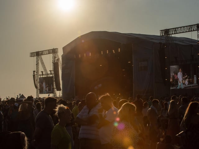 The sun begins to set as The Vaccines play on the Common Stage. Picture: (250819-078)