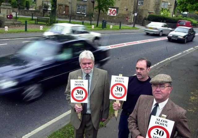 Hickelton residents with signs showing the new speed limits in place. Ken Johnson, Wilf Wellings and Dennis Thorpe, 2001.
