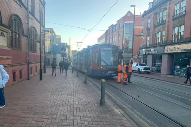 Trams have been suspended this morning in part of Sheffield city centre. Picture shows the broken down tram on West Street