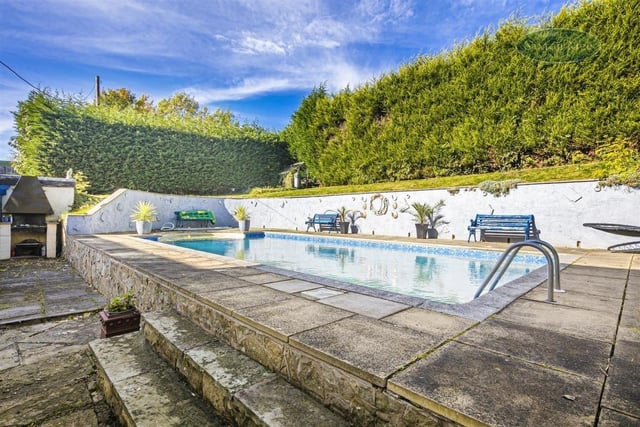 The pool is surrounded by patio, making it the centrepiece of a rather grand outdoor space.