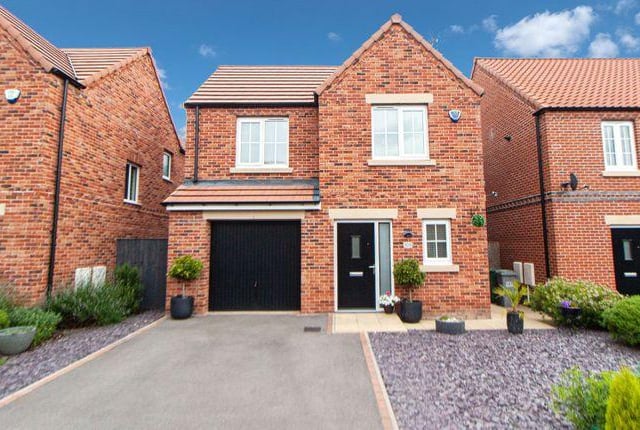 This three bedroom house has a modern kitchen with an island and an orangery with a woodland backdrop. Marketed by Keller Williams, 0113 427 8504,