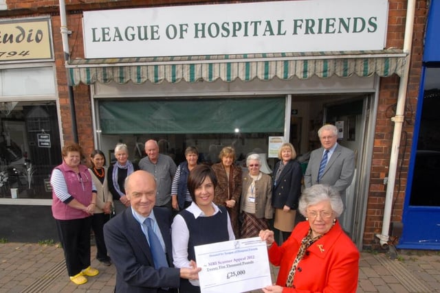 Barbara Joule, Chairman of Mansfield Hospitals League of Friends presents a cheque for #25,000 to former Chad editor Tracy Powell towards the trust’s scanner appeal in 2013.