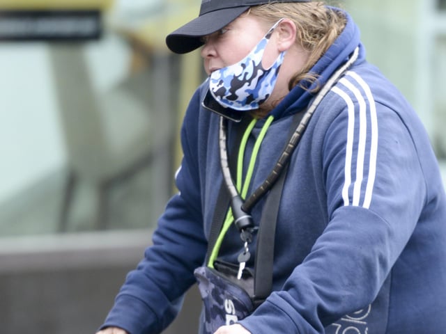A cyclist carries at shopping bag in Doncaster town cente yesterday