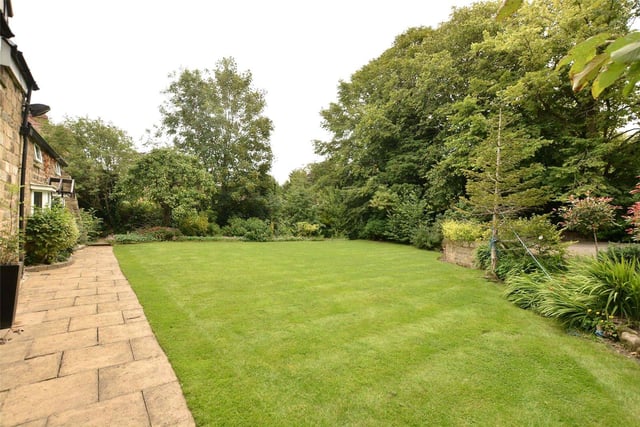 Landscaped gardens surround the property and are fully enclosed, offering complete privacy, and feature borders, shrubs and a paved patio area for alfresco dining.