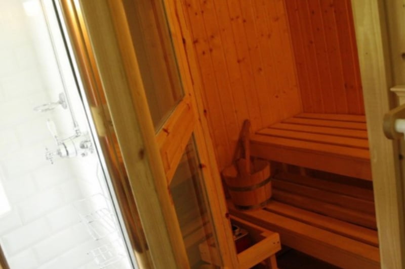 The sauna is located a few steps away from the kitchen.