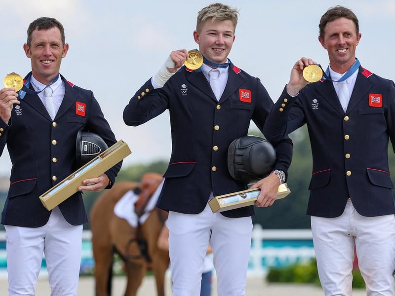 From left, Scott Brash, Harry Charles and Ben Maher with their gold medals after the equestrian jumping team final at the Paris 2024 Olympic Games.