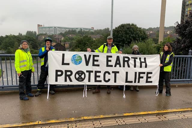 Sheffield's Extinction Rebellion hung a banner that speaks 'the truth' about climate change at the Park Square roundabout this morning.