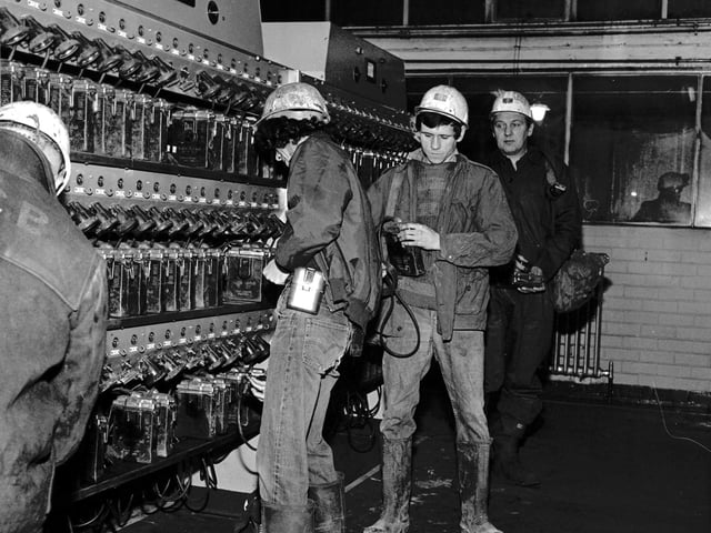 Miners at Monktonhall colliery collect their lamps from the lamphouse on one of the first shifts back after the strike ended in February 1972.