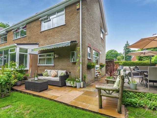 How the decked seating area and the patio area fits in nicely with the impressive appearance of the property at the side and back.